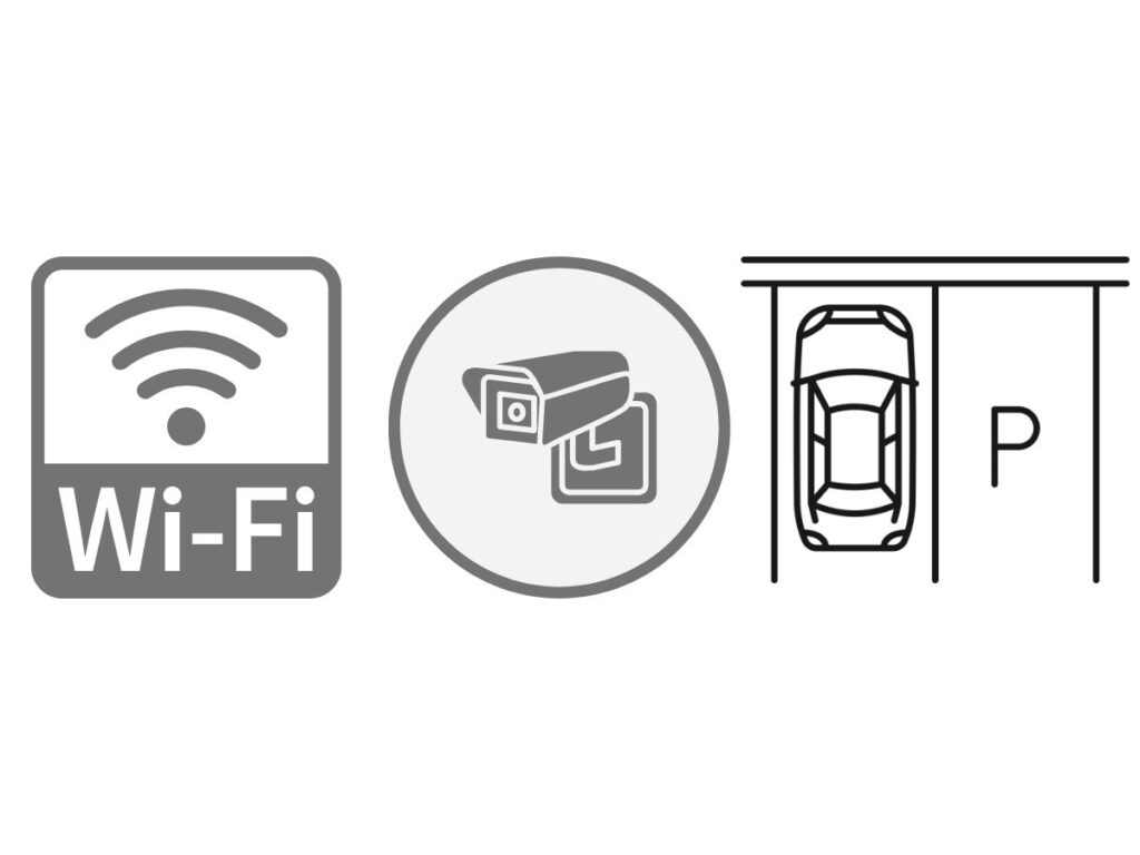 賃貸アパートやマンションの人気の設備・条件を表す3つのグレーのアイコン。左から「Wi-Fi（インターネット無料）」を意味する電波マークとWi-Fiの文字、中央に「防犯カメラ完備（セキュリティ）」を示すカメラのイラスト、右に「駐車場あり」を意味する車とPの文字のイラストが並んでいる。